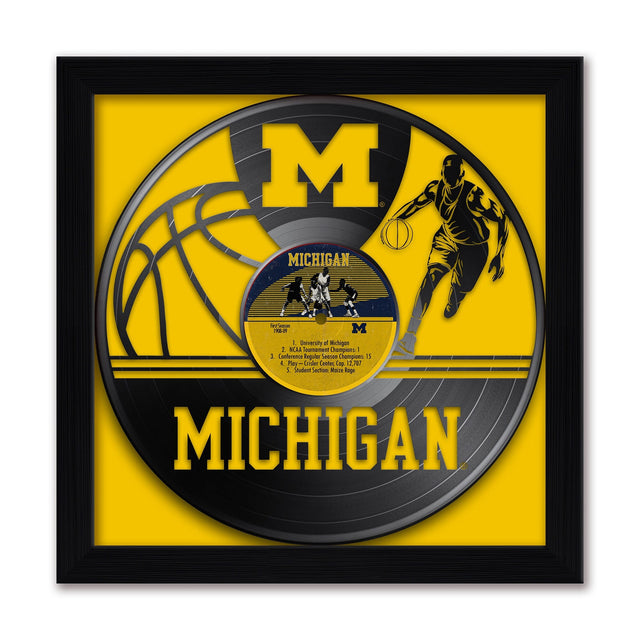 MICHIGAN  
Gen 9-49  
1. First Season of Michigan's 15  
2. NCAA Tournament Champions  
3. Conference Regular Season Champions  
4. Play-Off Center Cap 12,707  
5. Student Section Woize hoge  

MICHIGAN