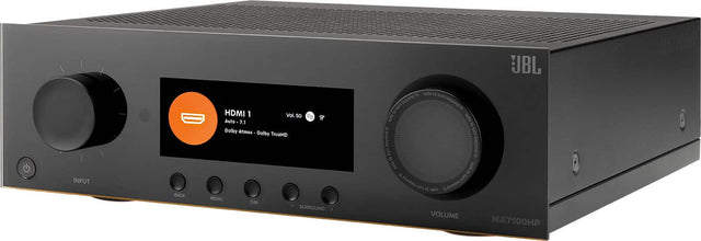 The text on the image reads: "INPUT BACK HDMI 1 Vol. s0 Auto 7.1 Dolby Atmos Dolby TrueHD MENU DIM SURROUND JBL 5 salo to Surn tumbeyond tumn beyond  safeto anfe 8 " sm beyond uoac um " g safe ajas = e puolg tum w  ages D  VOLUME MA7100HP."