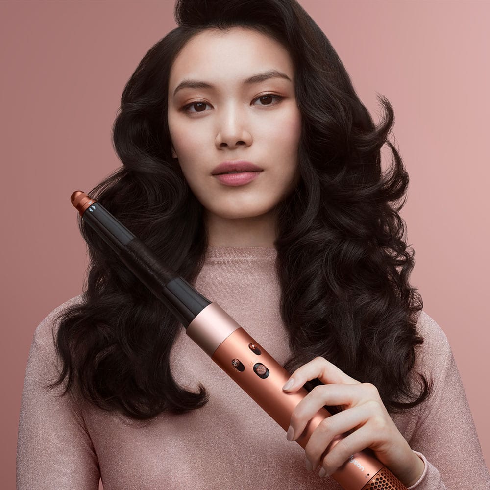 Person using hair styler
