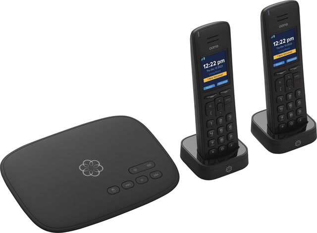 The image shows two cell phones placed on top of a black box, which is a router. The time displayed on the cell phones is 12:22 pm.