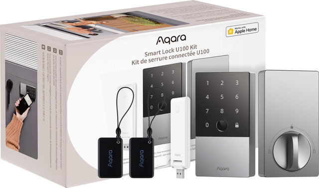 The image shows a box of Agara Smart Lock U100, which includes a smart lock, a keypad, and a remote control. The box is white and has a yellow tag on it. The smart lock and keypad are placed next to the box, while the remote control is positioned separately. The Agara U100 Kit is designed to provide secure and convenient access to your home or office.
