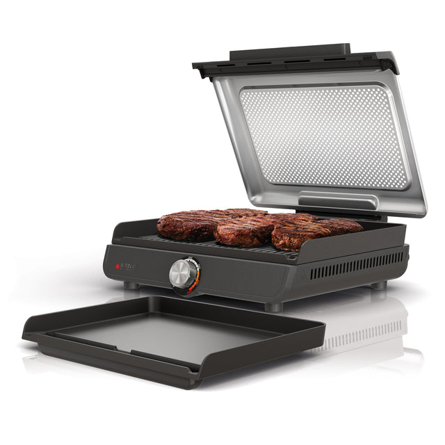 Angle. Ninja - Sizzle Countertop Indoor Grill & Griddle with Interchangeable Grill and Griddle Plates - Gray/Silver.