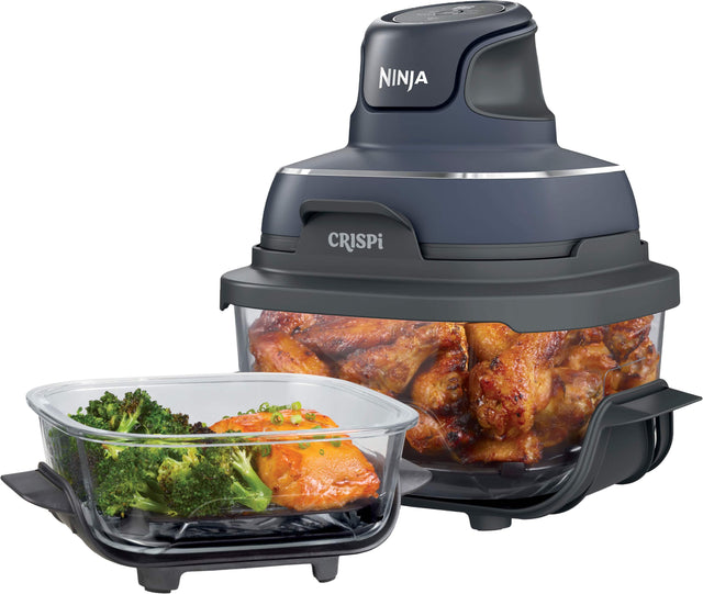 The Ninja Crisp is a versatile kitchen appliance that can be used for various cooking tasks, such as chopping, slicing, and even cooking. In the image, the Ninja Crisp is shown with a bowl of broccoli and carrots, as well as a bowl of chicken wings. The appliance is designed to make food preparation quick and easy, with its powerful motor and sharp blades. The Ninja Crisp is a convenient and efficient tool for anyone looking to save time and effort in the kitchen.